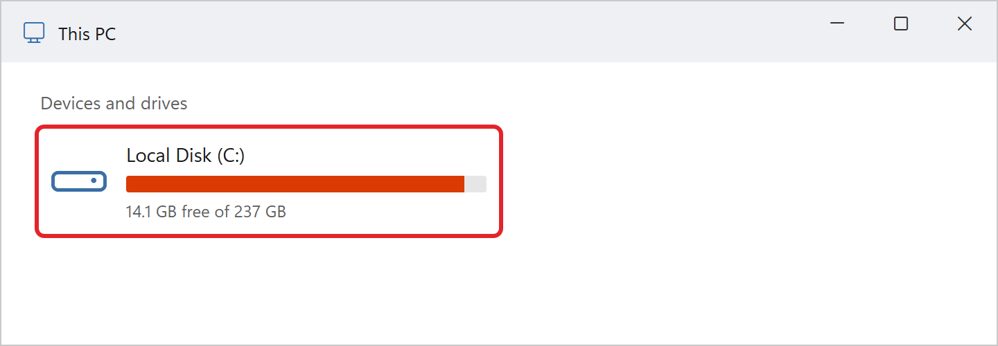 File Explorer showing This PC. Under Devices and drives, Local Disk (C:) has a nearly full red bar and the text 14.1 GB free of 237 GB.