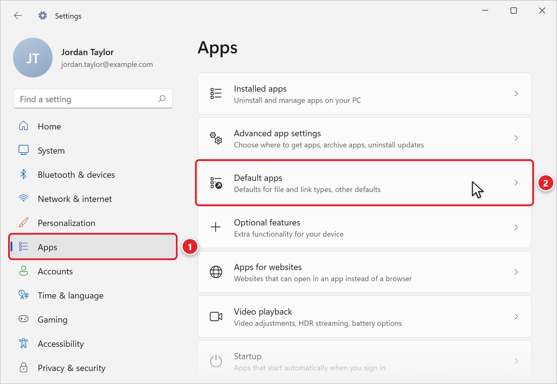 The Windows Settings app. In the left menu, Apps is marked 1. On the Apps page, the Default apps entry (Defaults for file and link types, other defaults) is marked 2.