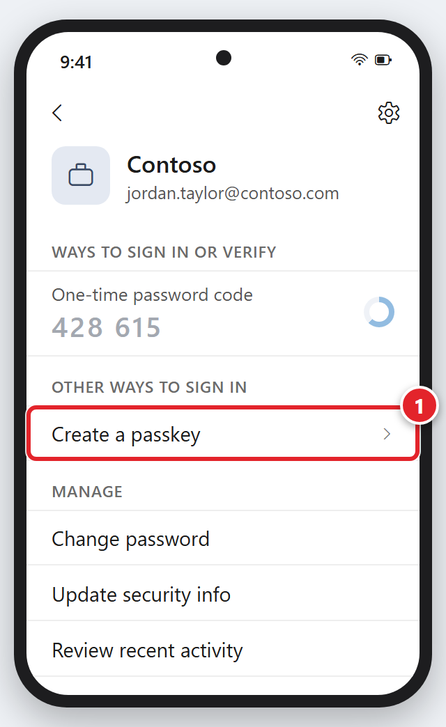 A phone showing the Microsoft Authenticator page for the Contoso account, jordan.taylor@contoso.com. Under Ways to sign in or verify is One-time password code, with a 6-digit code in light gray and a small countdown circle. Under Other ways to sign in, Create a passkey is marked 1. Under Manage are Change password, Update security info and Review recent activity.